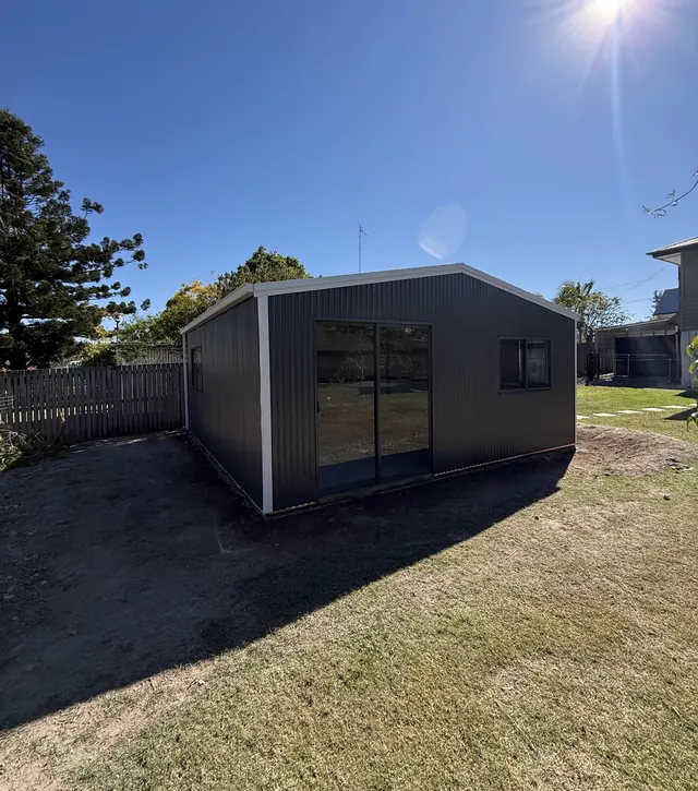 Steel shed with sliding glass doors