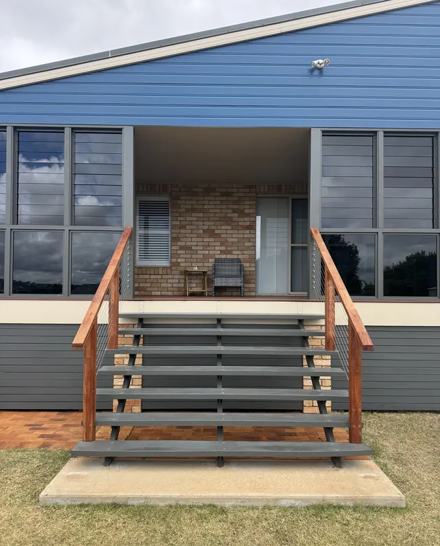 New front stairs with timber handrails