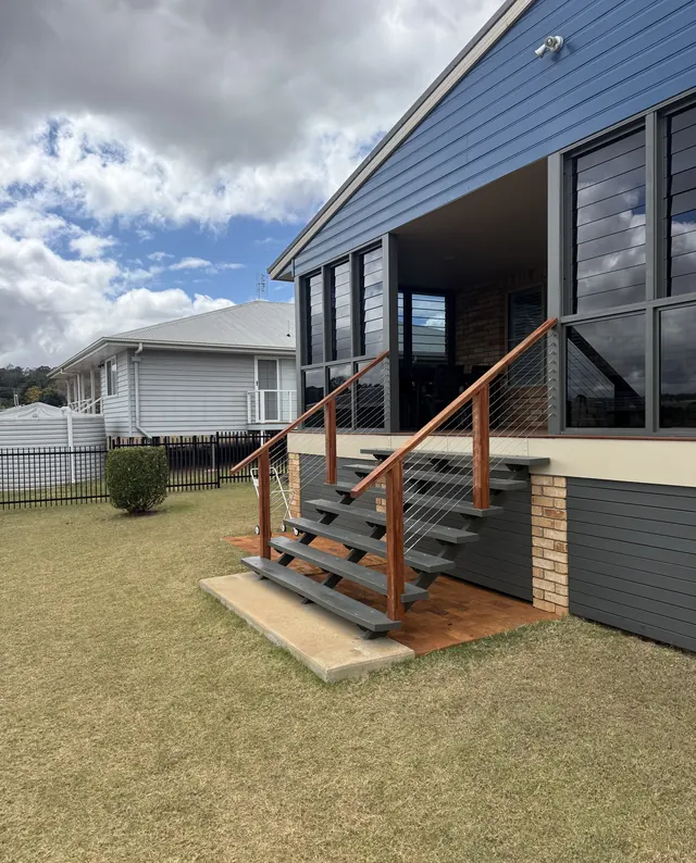 Stairs with timber rails and wire balustrade